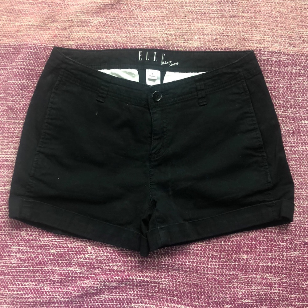 Black “khaki” style shorts.